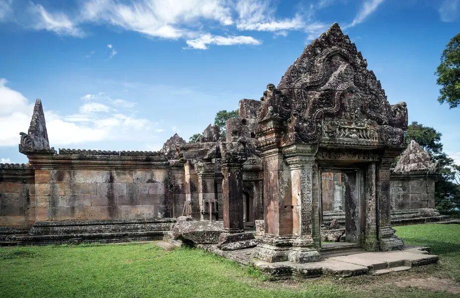 Sacred Preah Vihear temple atop Cambodia’s cliffs on a scenic Preah Vihear Travel banner by Legend Travel Group.